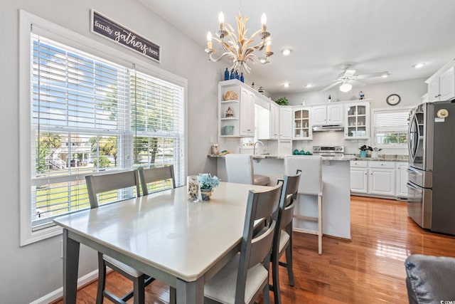 709 Triple Oak Ln, Garden City Beach, SC 29576 - dining area featuring a chandelier, a ceiling fan, light wood-type flooring, and recessed lighting