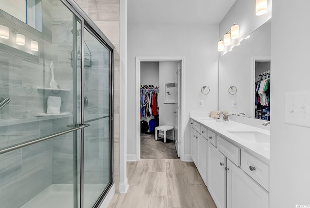 1360 Littleleaf Loop, North Myrtle Beach, SC 29582 - bathroom with a spacious closet, double vanity, and a stall shower