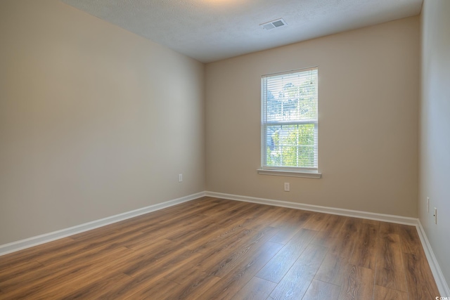 4524 E Walkerton Rd, Myrtle Beach, SC 29579 - unfurnished room featuring dark wood-style flooring and baseboards