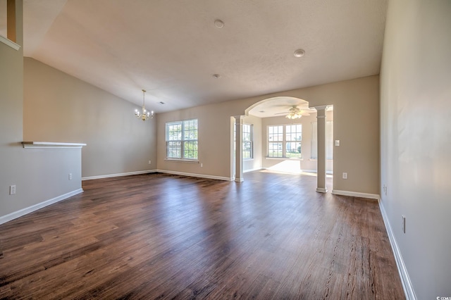 4524 E Walkerton Rd, Myrtle Beach, SC 29579 - unfurnished room featuring decorative columns, dark wood-style flooring, vaulted ceiling, arched walkways, and a chandelier