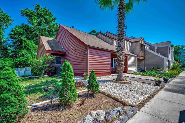 808 Myrtle Ct Unit 808, North Myrtle Beach, SC 29582 - view of side of property featuring roof with shingles