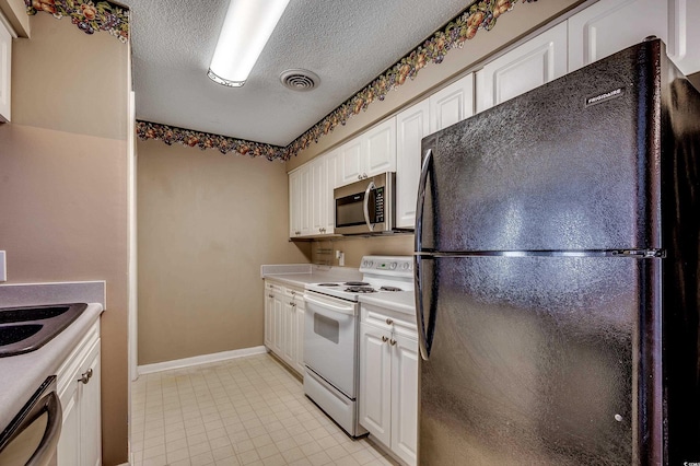 808 Myrtle Ct Unit 808, North Myrtle Beach, SC 29582 - kitchen featuring freestanding refrigerator, stainless steel microwave, white electric range oven, white cabinetry, and dishwashing machine