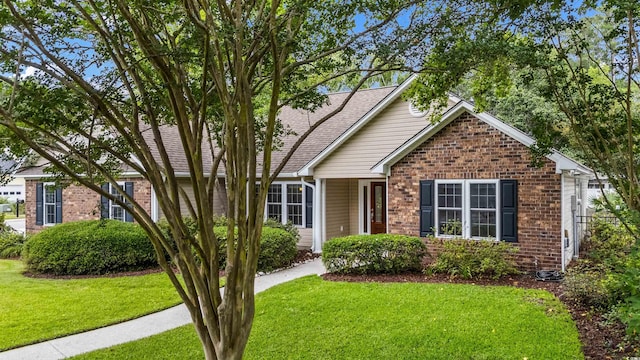 104 Ashton Cir, Myrtle Beach, SC 29588 - ranch-style house with brick siding, a front lawn, and roof with shingles