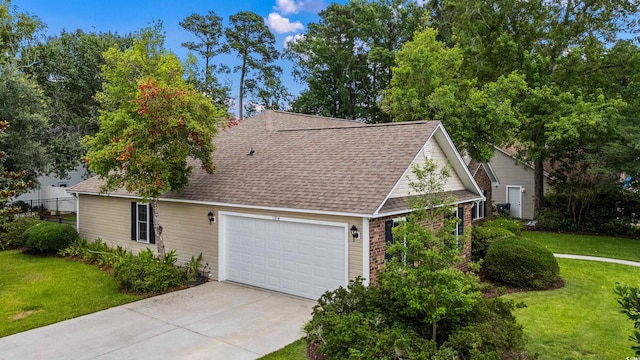 104 Ashton Cir, Myrtle Beach, SC 29588 - view of front of home featuring a front yard, roof with shingles, driveway, and an attached garage