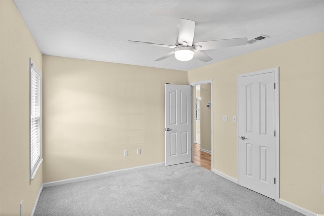 104 Ashton Cir, Myrtle Beach, SC 29588 - unfurnished bedroom featuring carpet, a ceiling fan, and a textured ceiling
