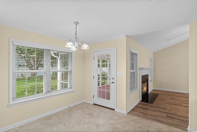 104 Ashton Cir, Myrtle Beach, SC 29588 - unfurnished dining area featuring a chandelier, a fireplace with flush hearth, ornamental molding, and wood finished floors
