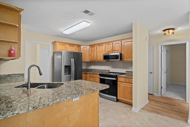 104 Ashton Cir, Myrtle Beach, SC 29588 - kitchen featuring stainless steel appliances, light stone countertops, open shelves, a peninsula, and backsplash