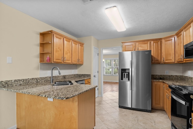 104 Ashton Cir, Myrtle Beach, SC 29588 - kitchen featuring black appliances, a peninsula, backsplash, dark stone counters, and open shelves