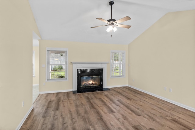 104 Ashton Cir, Myrtle Beach, SC 29588 - unfurnished living room with vaulted ceiling, wood finished floors, healthy amount of natural light, and ceiling fan