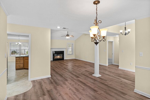 104 Ashton Cir, Myrtle Beach, SC 29588 - unfurnished living room featuring plenty of natural light, a chandelier, a high end fireplace, and recessed lighting