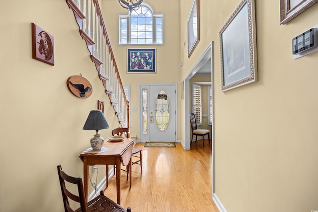 509 June Bug Ct, Myrtle Beach, SC 29588 - foyer featuring light wood-type flooring, stairs, and a high ceiling