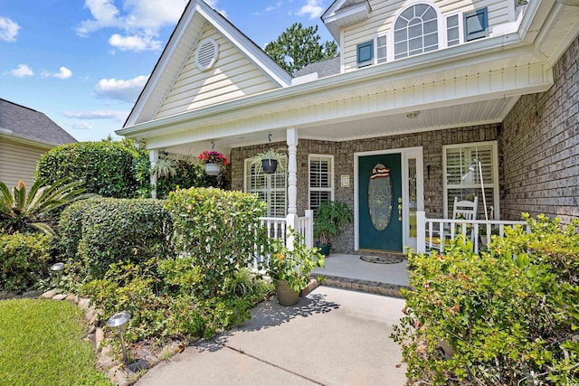 509 June Bug Ct, Myrtle Beach, SC 29588 - view of exterior entry featuring a porch
