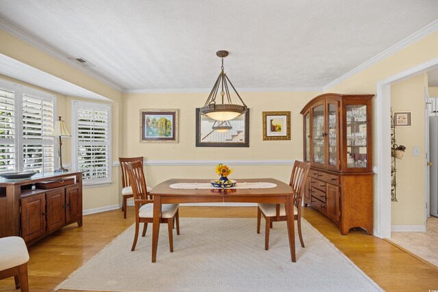 509 June Bug Ct, Myrtle Beach, SC 29588 - dining room featuring light wood-type flooring and crown molding