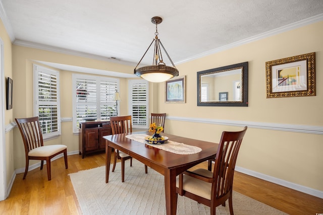 509 June Bug Ct, Myrtle Beach, SC 29588 - dining room with light wood-type flooring and crown molding