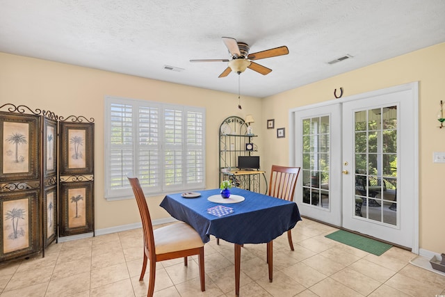 509 June Bug Ct, Myrtle Beach, SC 29588 - dining area with french doors, healthy amount of natural light, ceiling fan, light tile patterned floors, and a textured ceiling