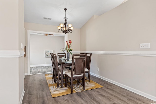 1007 Autumn Dr, Murrells Inlet, SC 29576 - dining room featuring wood finished floors, a chandelier, and lofted ceiling
