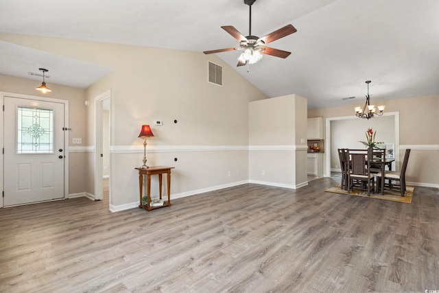 1007 Autumn Dr, Murrells Inlet, SC 29576 - living area with wood finished floors, a chandelier, lofted ceiling, and a ceiling fan