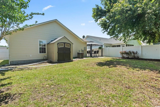 1007 Autumn Dr, Murrells Inlet, SC 29576 - back of house with a gazebo, a storage unit, and a patio