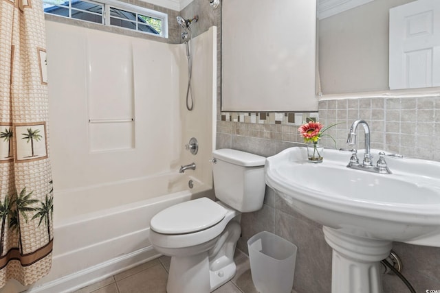 1007 Autumn Dr, Murrells Inlet, SC 29576 - full bathroom featuring shower / bath combo with shower curtain, tile patterned flooring, tile walls, and a wainscoted wall