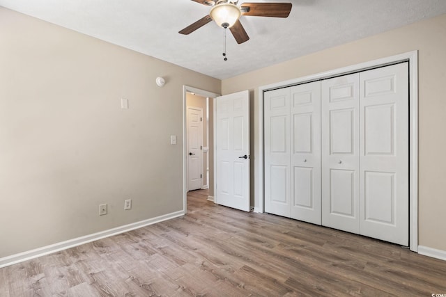 1007 Autumn Dr, Murrells Inlet, SC 29576 - unfurnished bedroom featuring wood finished floors, a closet, and a ceiling fan