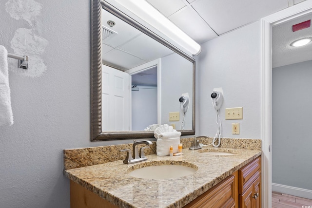 4800 S Ocean Blvd Unit 1008, North Myrtle Beach, SC 29582 - bathroom with double vanity and baseboards