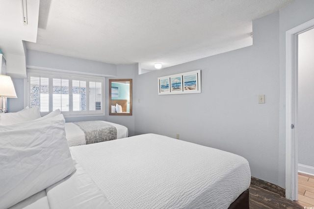 4800 S Ocean Blvd Unit 1008, North Myrtle Beach, SC 29582 - bedroom featuring wood finished floors and baseboards
