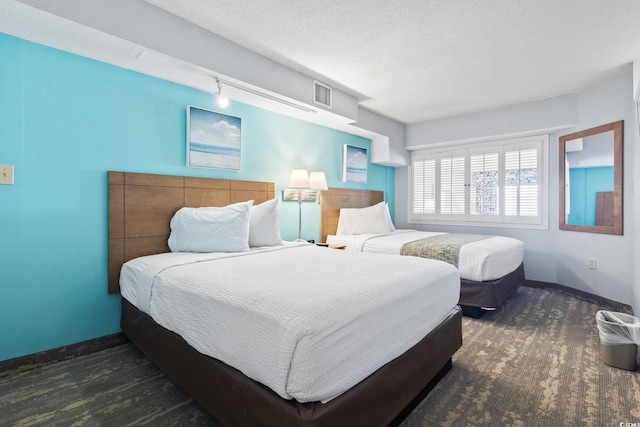 4800 S Ocean Blvd Unit 1008, North Myrtle Beach, SC 29582 - bedroom featuring rail lighting and baseboards