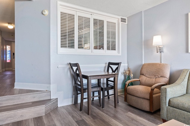 4800 S Ocean Blvd Unit 1008, North Myrtle Beach, SC 29582 - living area featuring wood finished floors and a textured ceiling