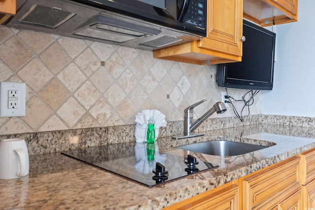 4800 S Ocean Blvd Unit 1008, North Myrtle Beach, SC 29582 - kitchen with black electric cooktop, backsplash, and light countertops