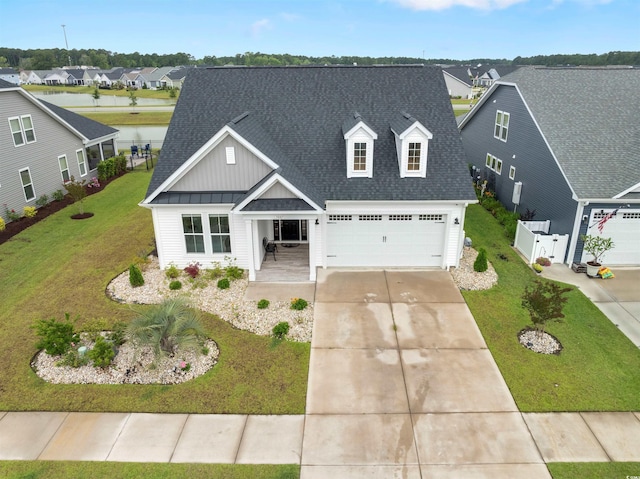 5087 Sundrop Ln, Little River, SC 29566 - view of front of home featuring driveway, a shingled roof, a residential view, and a porch