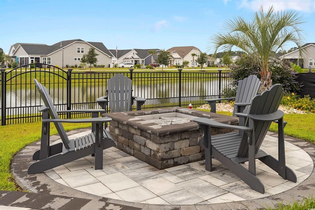 5087 Sundrop Ln, Little River, SC 29566 - view of patio / terrace featuring an outdoor fire pit, a residential view, and a water view