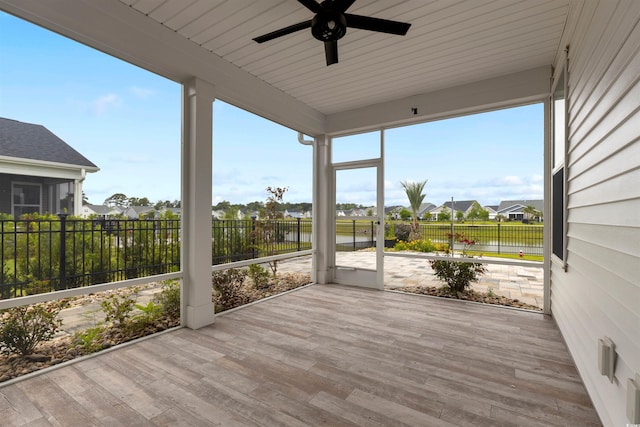 5087 Sundrop Ln, Little River, SC 29566 - unfurnished sunroom featuring a ceiling fan, a water view, and a residential view