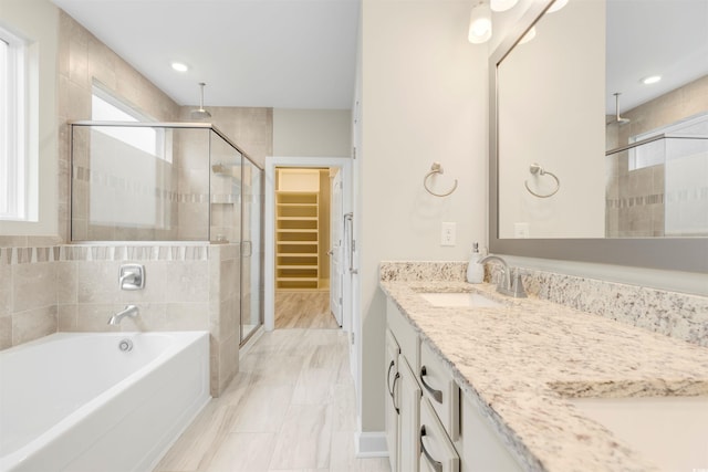 5087 Sundrop Ln, Little River, SC 29566 - full bathroom with a stall shower, plenty of natural light, double vanity, a bath, and recessed lighting
