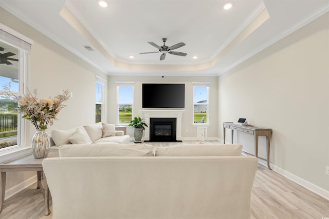 5087 Sundrop Ln, Little River, SC 29566 - living room with a ceiling fan, a tray ceiling, healthy amount of natural light, crown molding, and recessed lighting