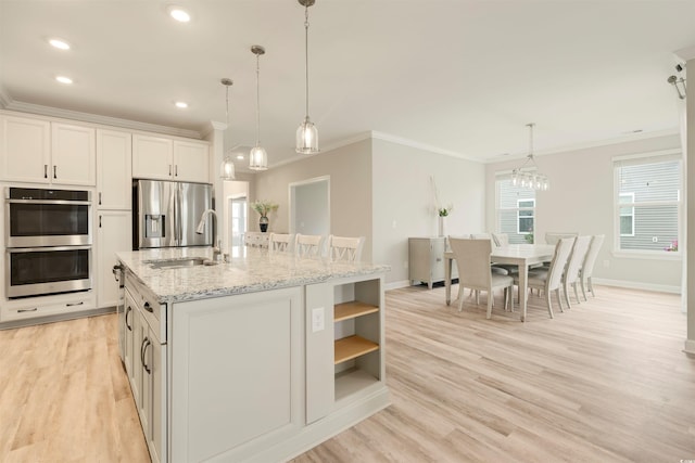 5087 Sundrop Ln, Little River, SC 29566 - kitchen with crown molding, open shelves, stainless steel appliances, white cabinetry, and light wood-style floors