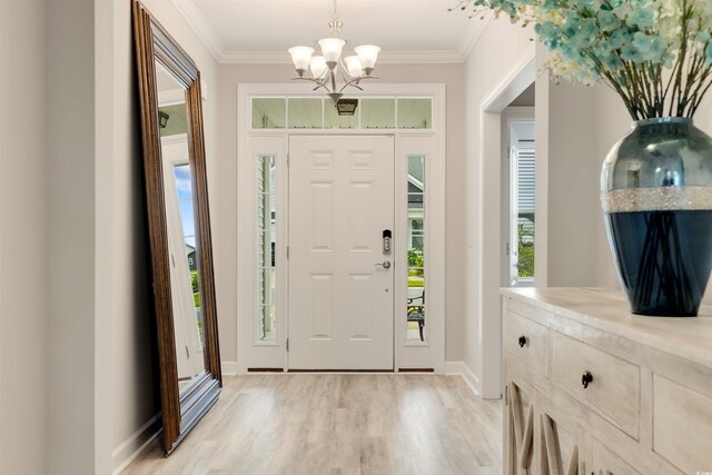 5087 Sundrop Ln, Little River, SC 29566 - entrance foyer with a chandelier, light wood finished floors, and ornamental molding