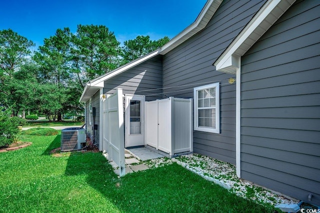 220 Gateway Dr, Little River, SC 29566 - view of property exterior featuring a cooling unit and a lawn