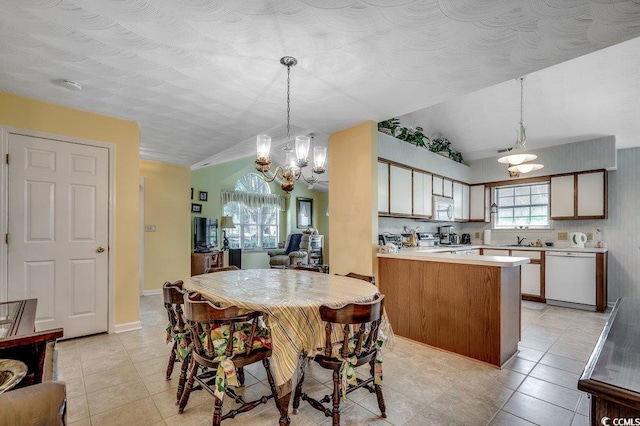 220 Gateway Dr, Little River, SC 29566 - dining room with a chandelier, light tile patterned floors, and lofted ceiling