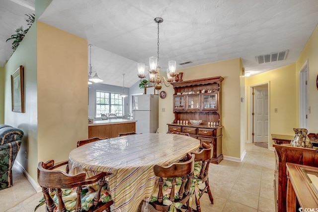 220 Gateway Dr, Little River, SC 29566 - dining space with a chandelier and light tile patterned floors