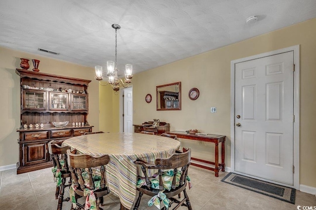 220 Gateway Dr, Little River, SC 29566 - dining room with a chandelier and light tile patterned flooring