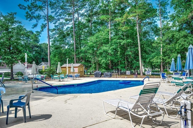 220 Gateway Dr, Little River, SC 29566 - community pool with view of wooded area and a patio