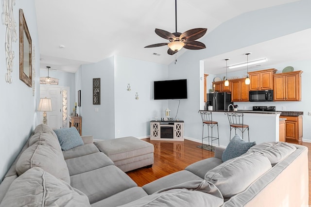 755 Wintercreeper Dr, Longs, SC 29568 - living area with vaulted ceiling, wood finished floors, and ceiling fan