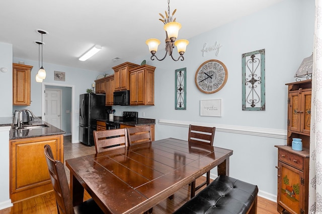 755 Wintercreeper Dr, Longs, SC 29568 - dining space featuring a chandelier and light wood-type flooring