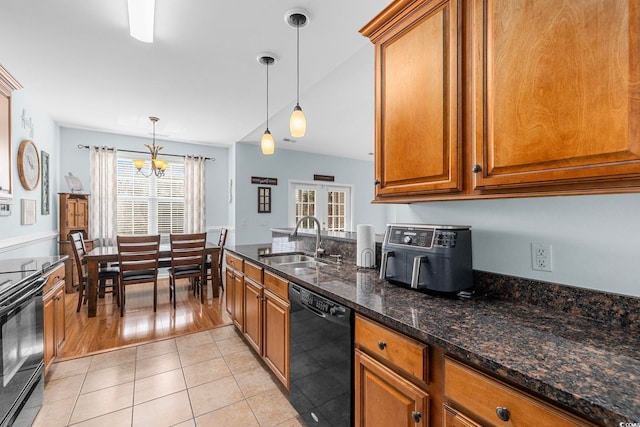 755 Wintercreeper Dr, Longs, SC 29568 - kitchen featuring black appliances, brown cabinetry, a chandelier, and hanging light fixtures