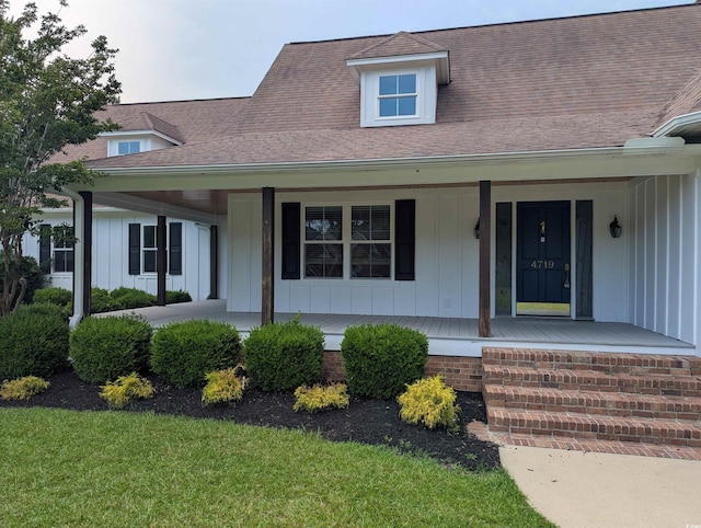 4719 National Dr, Myrtle Beach, SC 29579 - view of front of property with board and batten siding, covered porch, and roof with shingles
