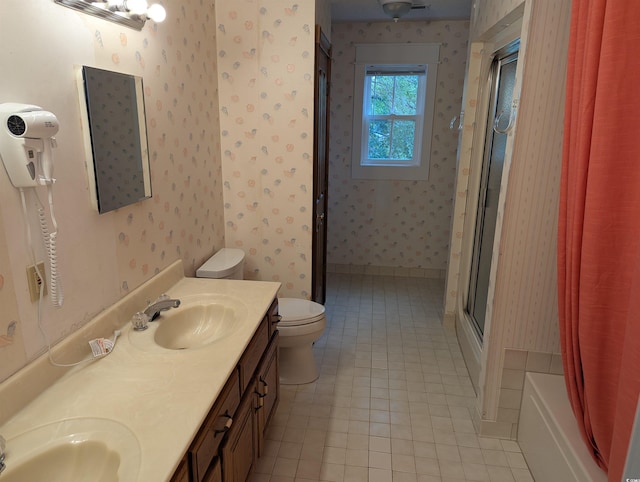 4719 National Dr, Myrtle Beach, SC 29579 - full bath with wallpapered walls, tile patterned flooring, double vanity, and combined bath / shower with glass door