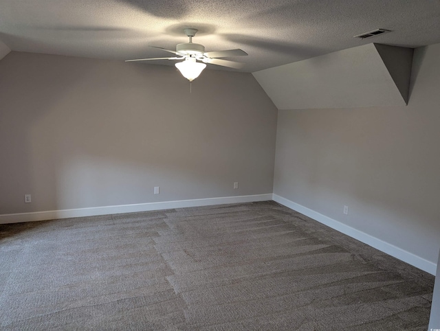 4719 National Dr, Myrtle Beach, SC 29579 - bonus room featuring vaulted ceiling, ceiling fan, dark colored carpet, and a textured ceiling