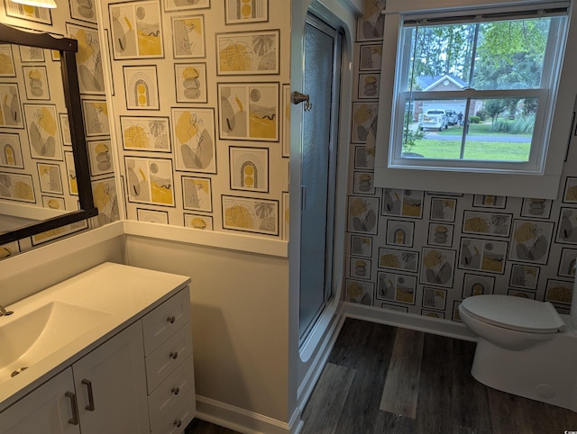 4719 National Dr, Myrtle Beach, SC 29579 - bathroom featuring wood finished floors, vanity, a shower stall, and wallpapered walls
