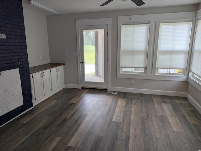 4719 National Dr, Myrtle Beach, SC 29579 - unfurnished dining area with a ceiling fan and dark wood-style flooring
