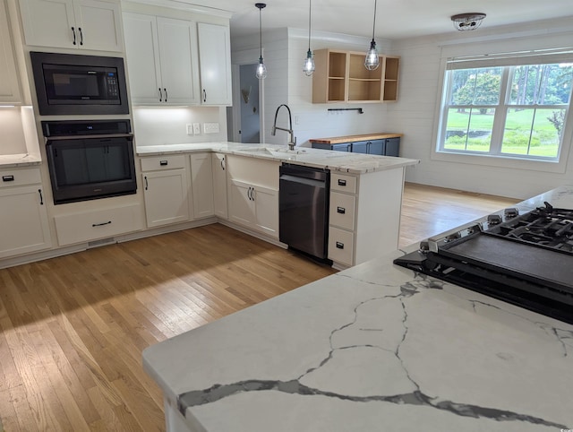 4719 National Dr, Myrtle Beach, SC 29579 - kitchen featuring oven, built in microwave, dishwashing machine, light wood-style floors, and open shelves